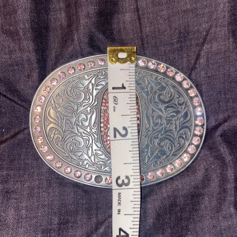 Browning Buck mark silver plated belt buckle with pink rhinestones.